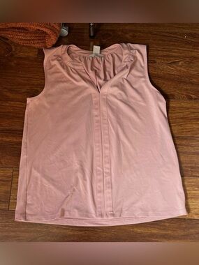 H&M sleeveless blouse featuring a v-notch neckline and pleated front detail